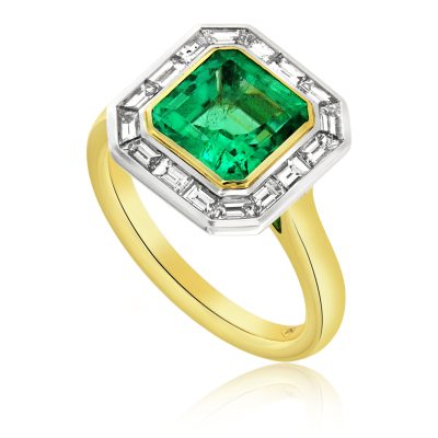 An Emerald and Diamond Cocktail or Dress ring made in 18ct white and yellow gold