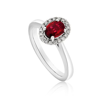 An 18ct white gold ruby and diamond halo or cluster ring