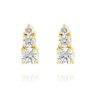 A pair of yellow gold and diamond stud earrings with 3 stones on each.