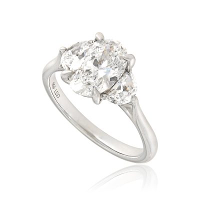 Oval half moon lab grown diamond trilogy engagement ring platinum