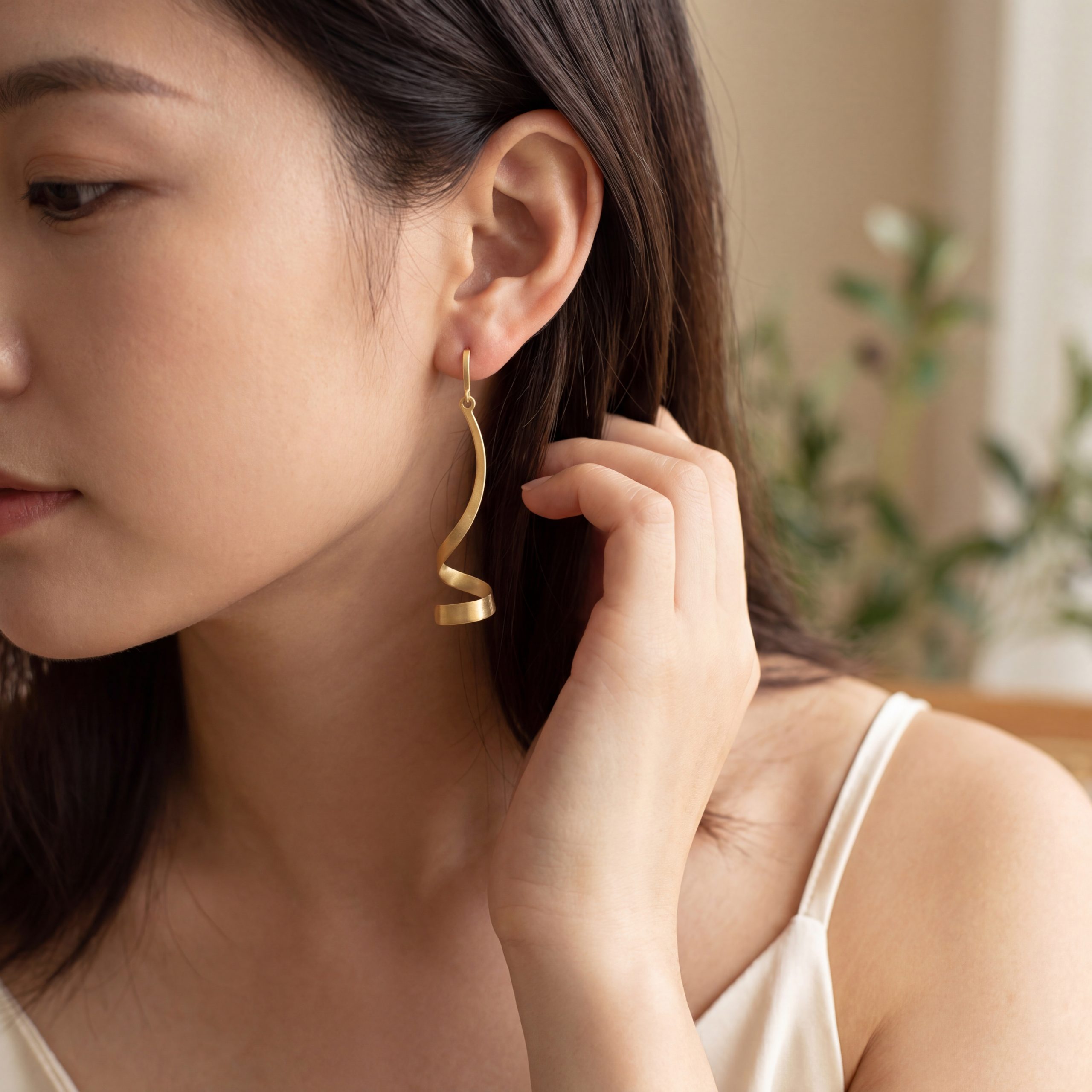 25318 Model Image Yellow gold twist drop earrings model wearing yellow gold twist drop earrings