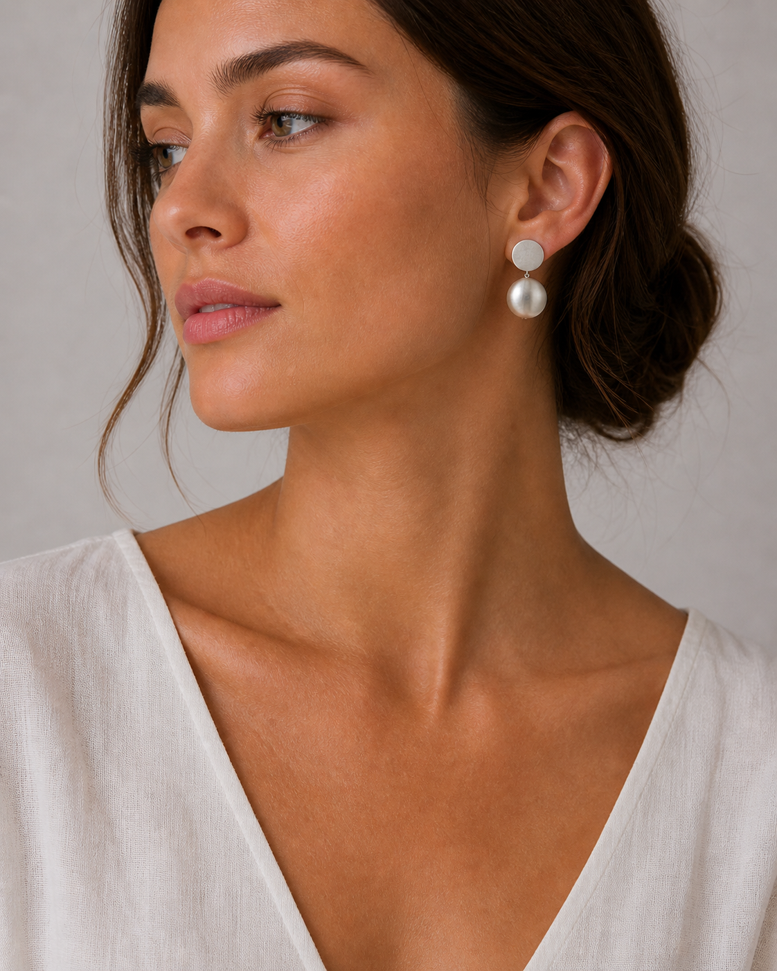 model 25309 Model wearing Silver Disc and Ball drop Earrings